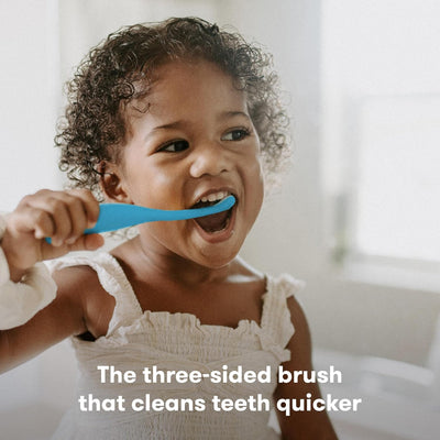 Frida Baby Training Toothbrush | Toddler Toothbrush for 18-24 Months, Easy-Grip Handle, Triple Angle Bristles, Soft Toothbrush Bristles, Stay-Put Suction Cup | Blue